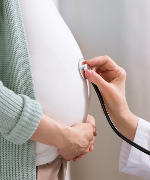 cropped-shot-of-doctor-with-stethoscope-listening-belly-of-pregnant-woman.jpg